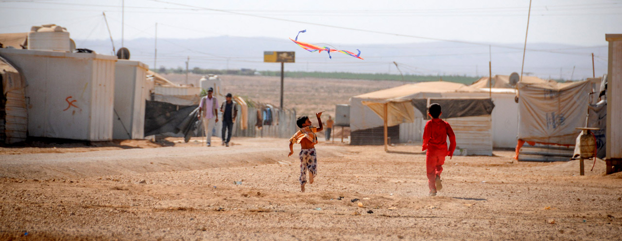 Kids play with kites in a refugee camp in Jordan. Image Courtesy of worldvision.org.