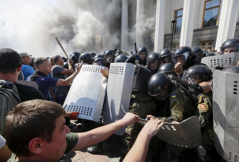 August 31, 2015 Police and Protesters clash outside of Parliament in Kiev, Ukraine. Image Courtesy of Newsweek.com.