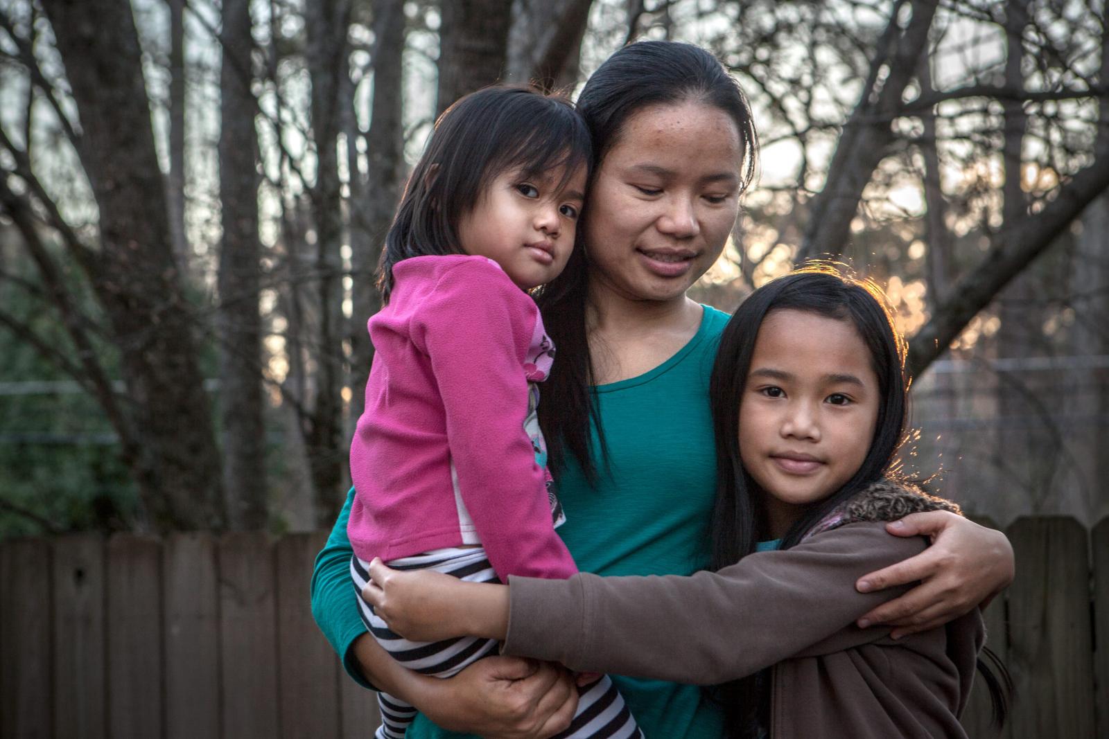 Klaw Htoo and her daughters Gloria and Sophia lived in a refugee camp in Thailand for nine years when they fled from Myanmar. Image Courtesy of rescue.org