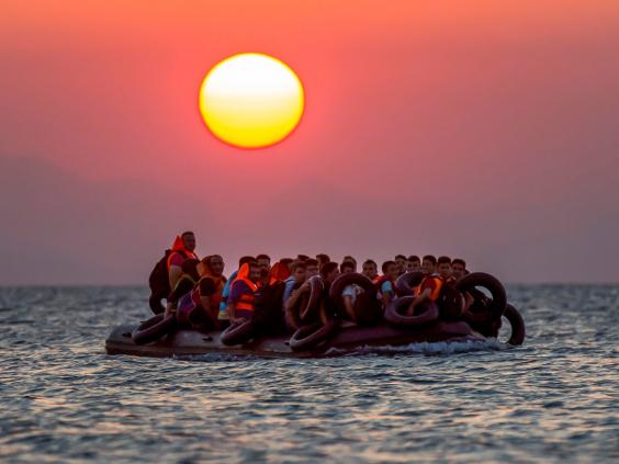 Refugees cross from Turkey to Greece in a dinghy. Image Courtesy of independent.co.uk.
